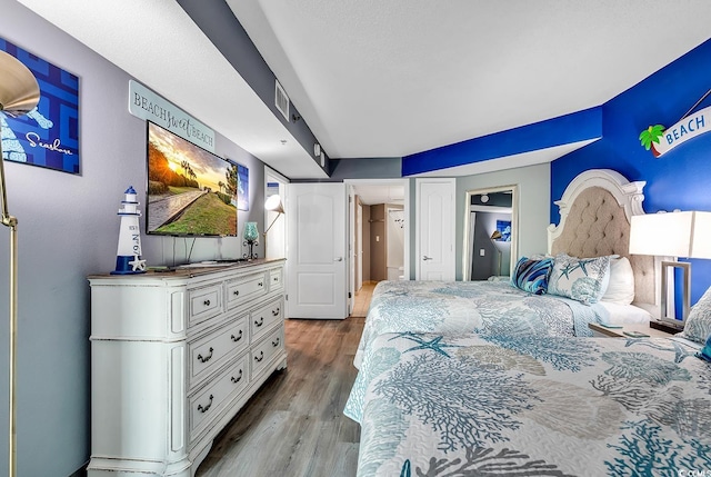 bedroom with light hardwood / wood-style floors