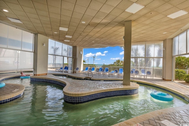 view of pool featuring a jacuzzi