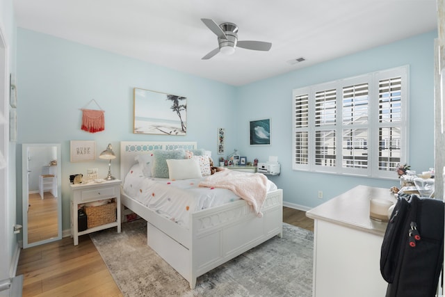 bedroom featuring ceiling fan and light hardwood / wood-style flooring