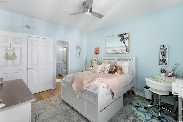 bedroom featuring ceiling fan, light hardwood / wood-style floors, and a closet