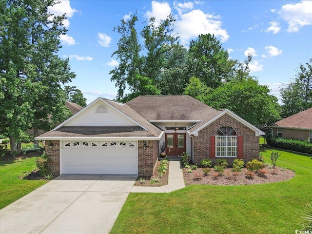 ranch-style home featuring a shingled roof, concrete driveway, an attached garage, french doors, and a front lawn