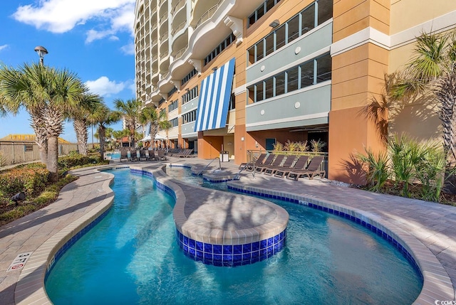 view of swimming pool with a patio area