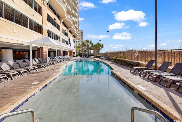 view of swimming pool with a patio