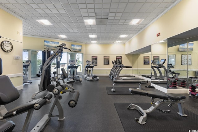 gym with a paneled ceiling