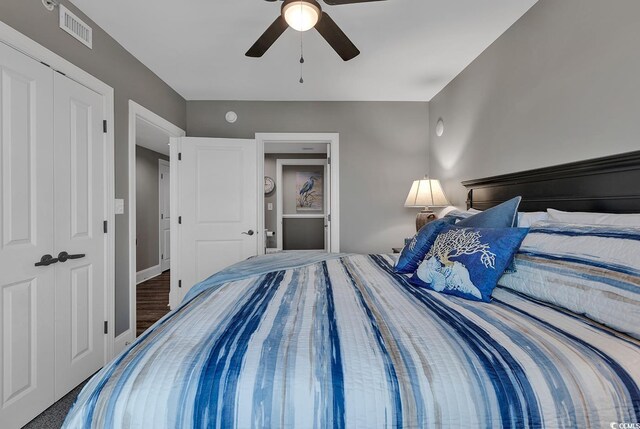 bedroom featuring ceiling fan and a closet