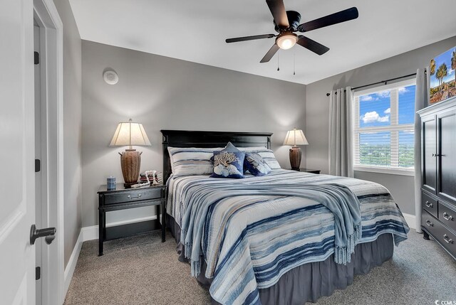 bedroom featuring ceiling fan and carpet floors