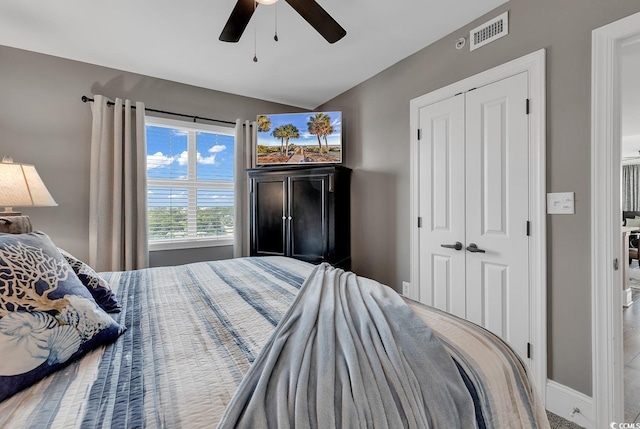 bedroom featuring ceiling fan and a closet