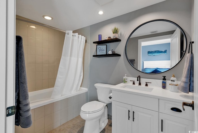 full bathroom featuring tile patterned flooring, vanity, shower / tub combo, and toilet