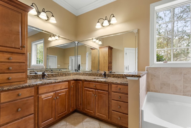 bathroom featuring tile patterned floors, a tub to relax in, vanity, and ornamental molding