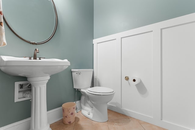 bathroom featuring tile patterned flooring and toilet