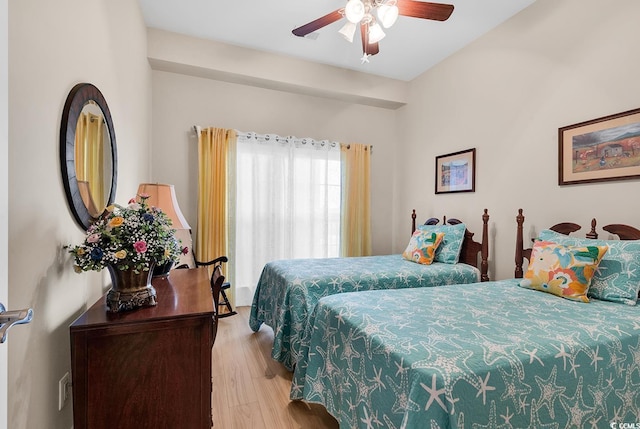 bedroom with ceiling fan and light hardwood / wood-style flooring