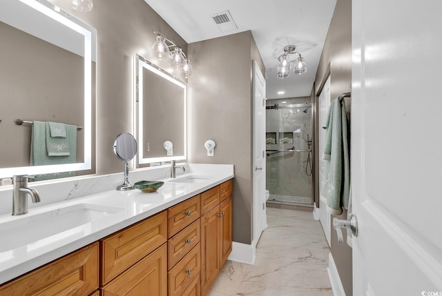 bathroom featuring vanity, toilet, and a shower with door