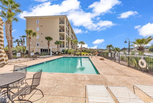 view of pool featuring a patio