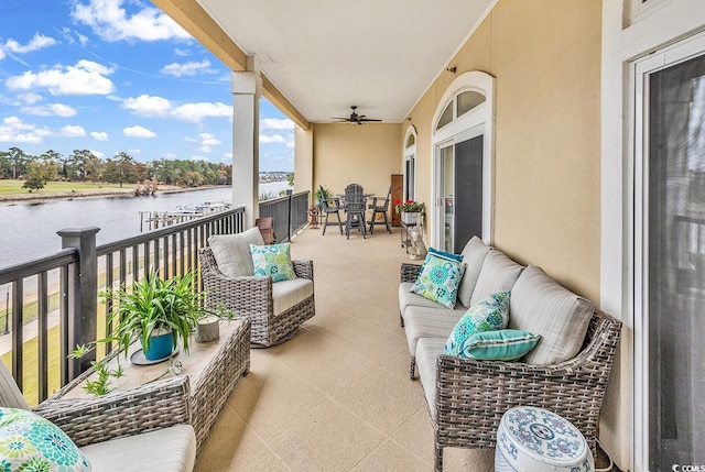 balcony featuring a water view