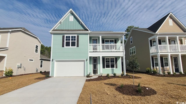 view of front facade with a garage, a balcony, and a front lawn