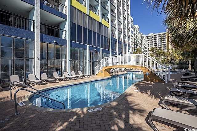 view of swimming pool featuring a patio