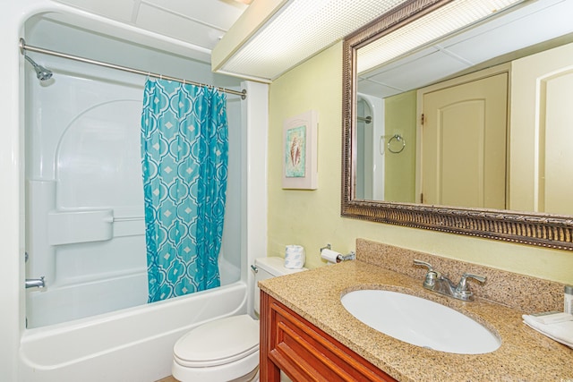 full bathroom with shower / tub combo, vanity, and toilet