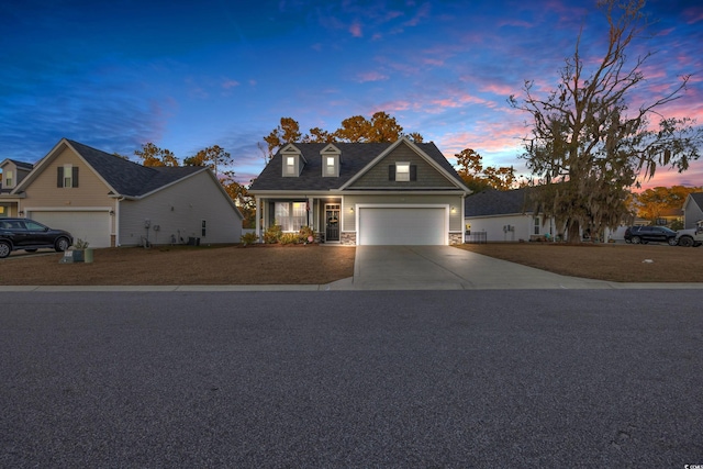 view of front facade with a porch and a garage