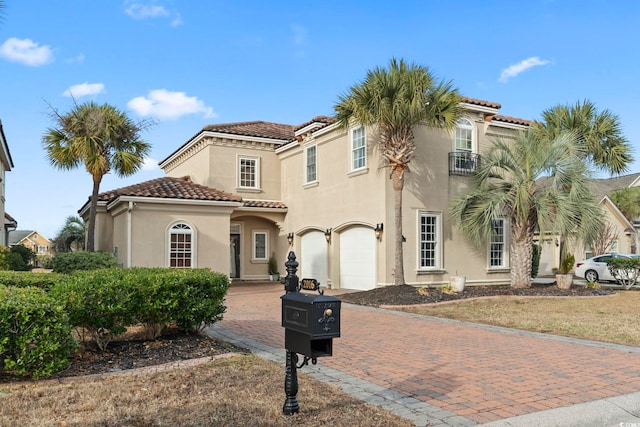 mediterranean / spanish-style house featuring a garage