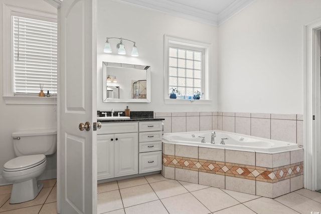 bathroom featuring tile patterned floors, vanity, crown molding, tiled bath, and toilet