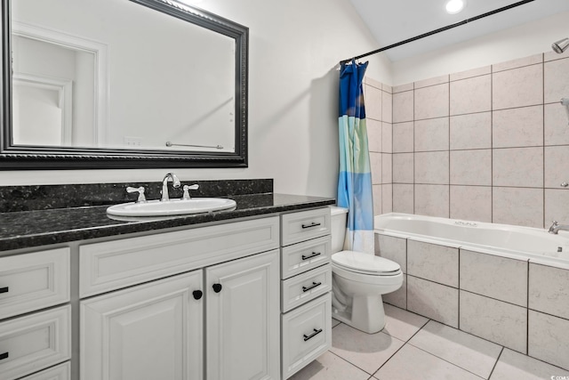 full bathroom featuring tile patterned flooring, vanity, toilet, and shower / bath combo with shower curtain