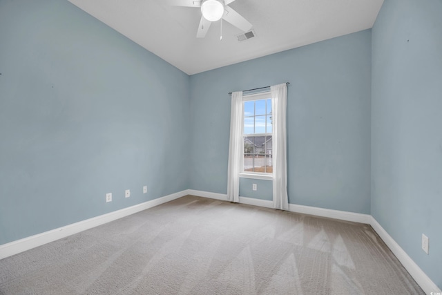 spare room featuring ceiling fan and carpet floors