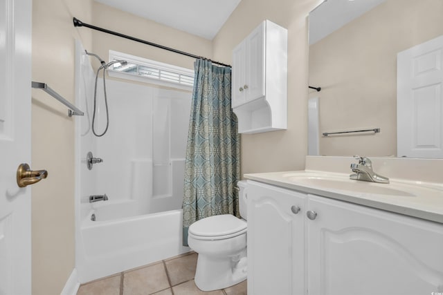 full bathroom featuring shower / bath combo with shower curtain, tile patterned flooring, vanity, and toilet