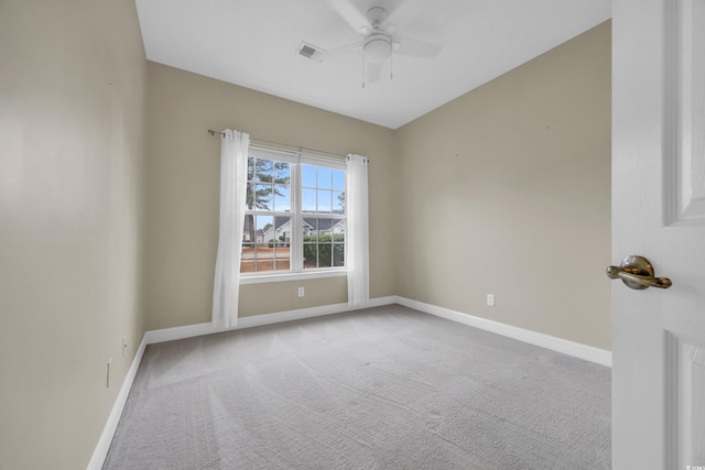 spare room featuring carpet flooring and ceiling fan