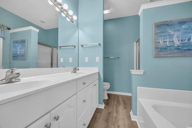 full bathroom featuring plus walk in shower, toilet, vanity, and hardwood / wood-style flooring