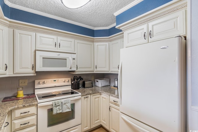 kitchen featuring cream cabinetry, crown molding, tasteful backsplash, a textured ceiling, and white appliances