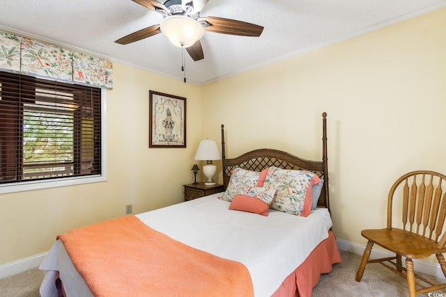 bedroom with baseboards, ornamental molding, and light colored carpet