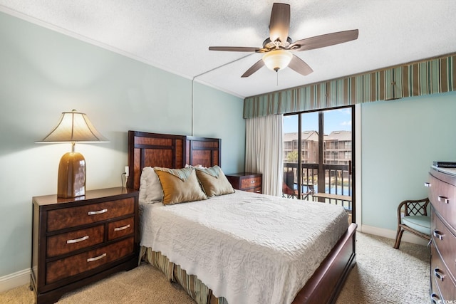 bedroom with access to exterior, light colored carpet, a textured ceiling, and baseboards