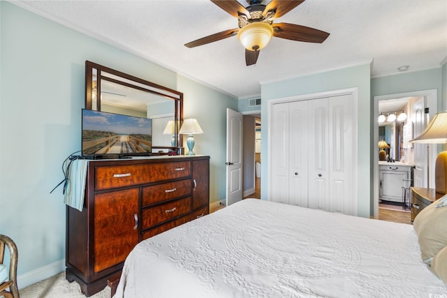 bedroom with visible vents, baseboards, a ceiling fan, ornamental molding, and a closet