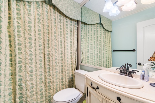 full bathroom with ornamental molding, vanity, toilet, and curtained shower