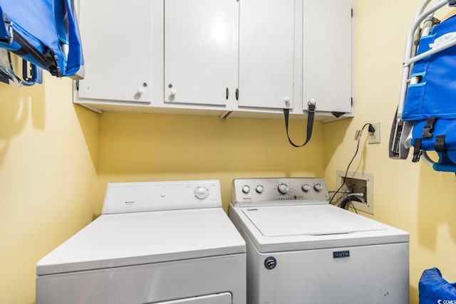 laundry room featuring cabinet space and washer and dryer