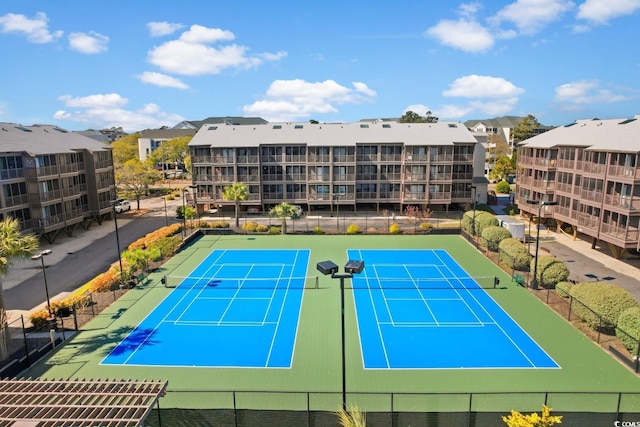 view of tennis court with fence