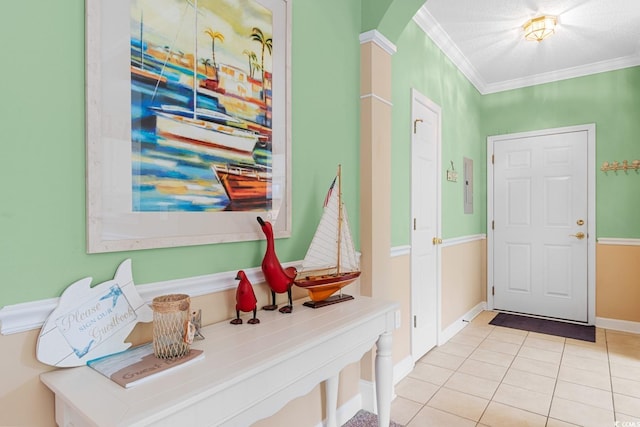 mudroom with ornamental molding and light tile patterned flooring