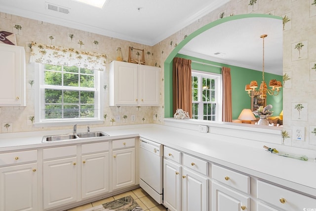 kitchen with sink, pendant lighting, white cabinets, and white dishwasher