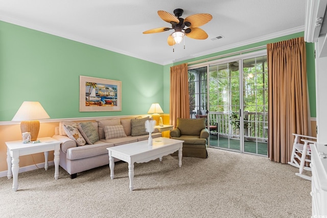 carpeted living room with crown molding and ceiling fan