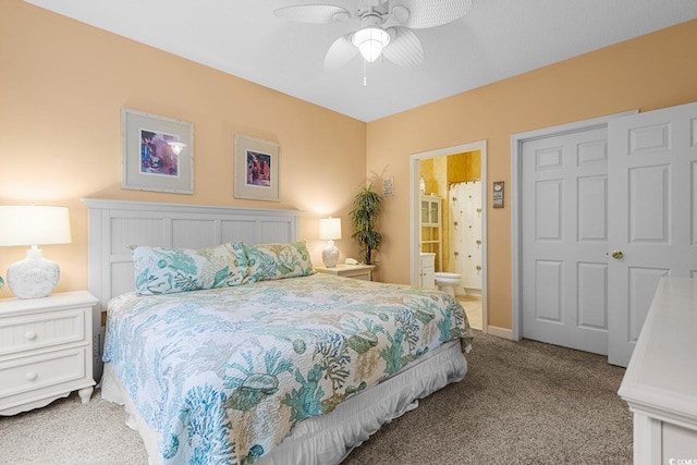 bedroom with light carpet, ceiling fan, and ensuite bath