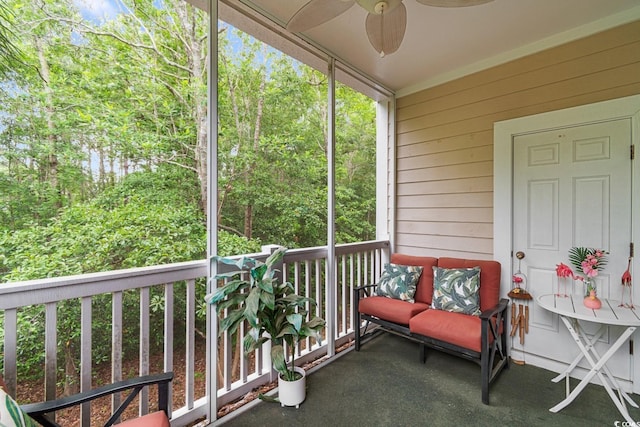 sunroom / solarium featuring ceiling fan