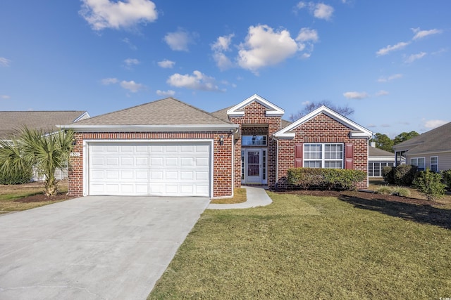 view of front of home featuring a front lawn and a garage