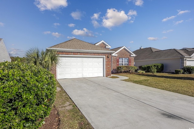 ranch-style house featuring a front lawn and a garage