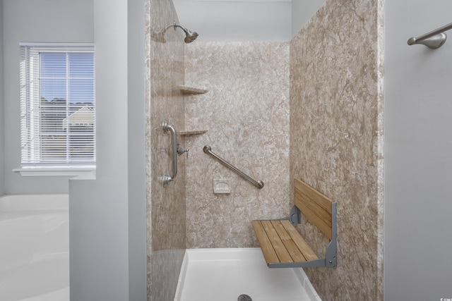 bathroom featuring tiled shower