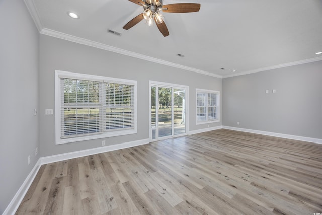 spare room with crown molding, ceiling fan, and light hardwood / wood-style floors