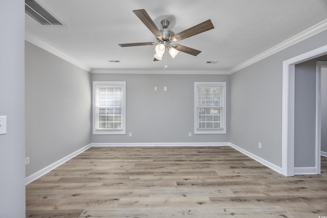 spare room featuring ceiling fan, light wood-type flooring, and ornamental molding