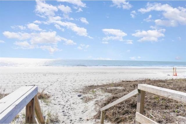 view of water feature with a beach view