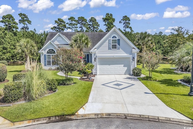 view of front of house featuring a garage and a front lawn