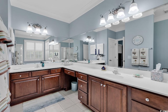 bathroom featuring tile patterned floors, vanity, a shower with shower door, and ornamental molding