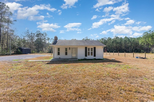 ranch-style home with a front lawn